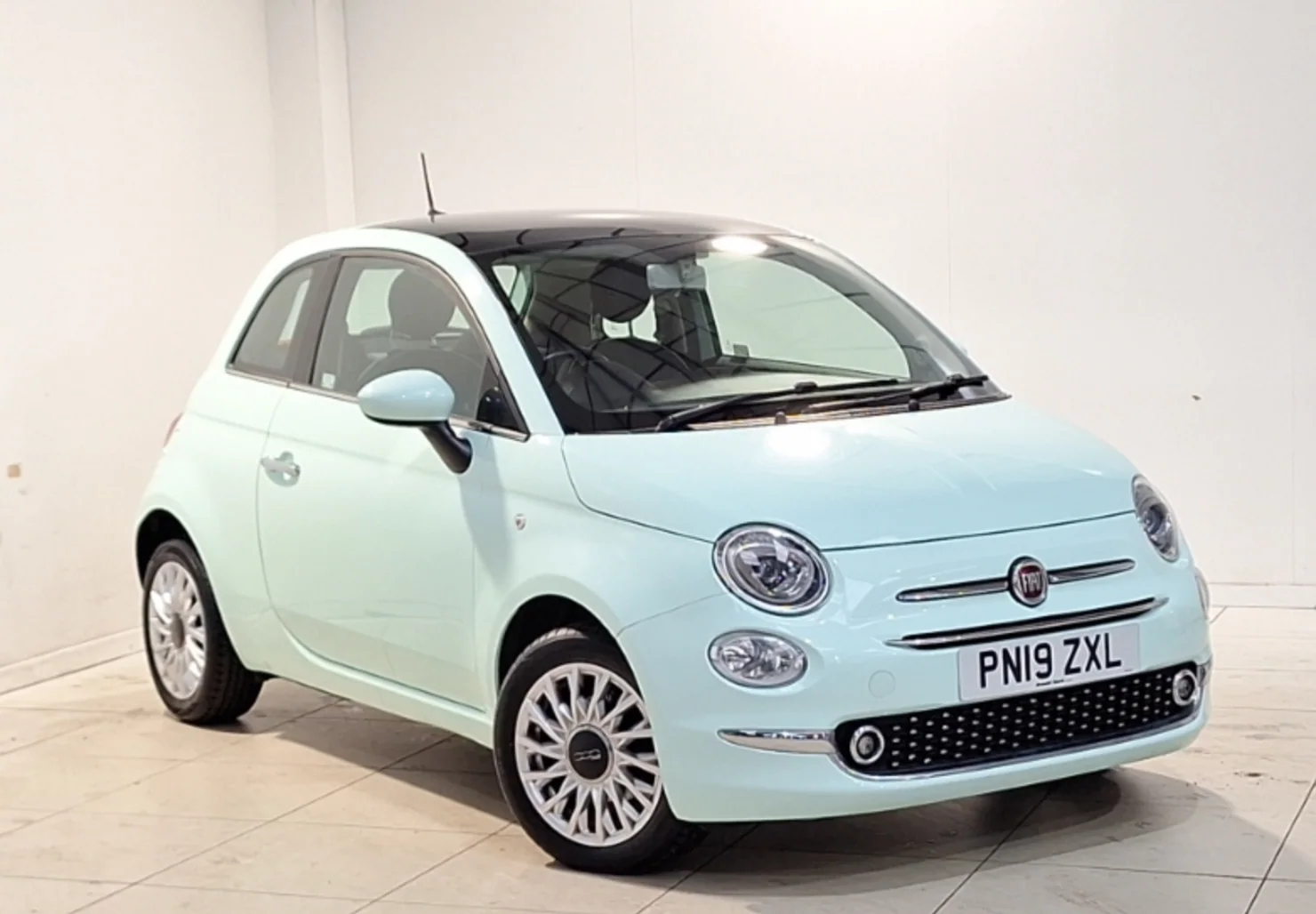 Mint green Fiat 500 front three-quarter view